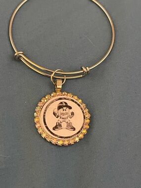 Gold-Tone Charm Bangle Bracelet with Yellow Crystal Accent